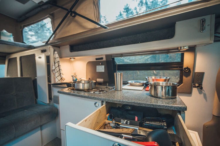 Kitchen inside a 2008 4x4 Sportsmobile Ford Econoline Adventure Van