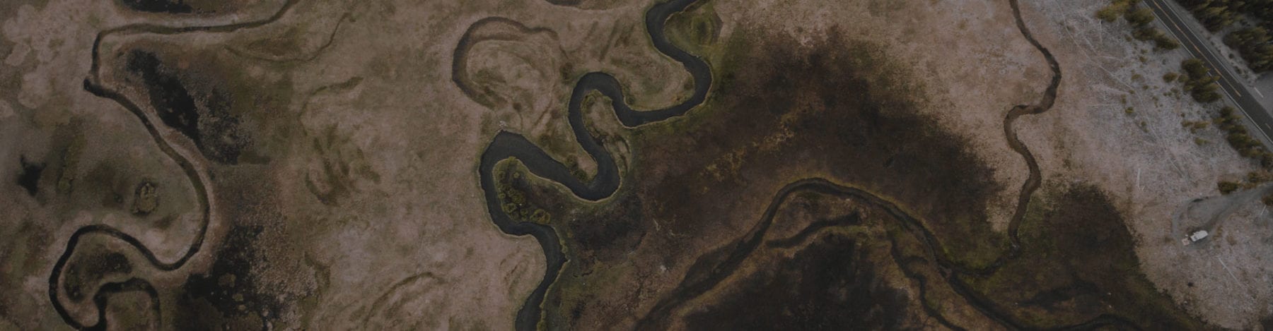 Aerial shot of lake and camper van rental in Oregon