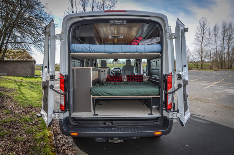 Rear view of 2 beds in a converted Ford Transit campervan in Oregon