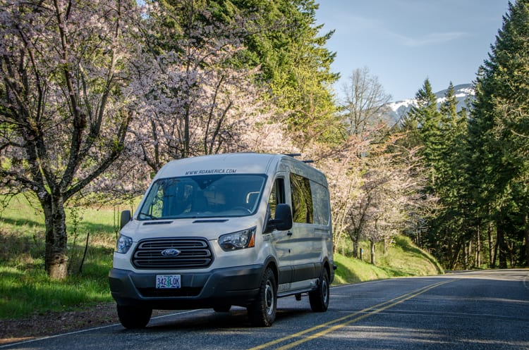 Exterior shot of front side of Ford Transit Campervan built by Axis Vehicle Outfitters in Portland, Oregon