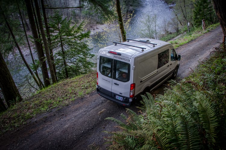 Exterior roof with fan and roof racks on a Ford Transit Campervan built by Axis Vehicle Outfitters in Portland, Oregon
