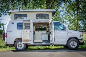 Inside look of 2wd Ford Econolibe Sportsmobile campervan for sale in Portland, Oregon through Roamerica camper van rental company