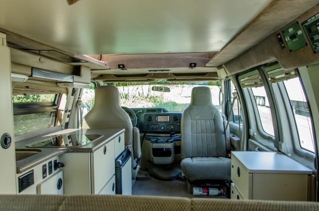 Inside look of 2wd Ford Econolibe Sportsmobile campervan for sale in Portland, Oregon through Roamerica camper van rental company