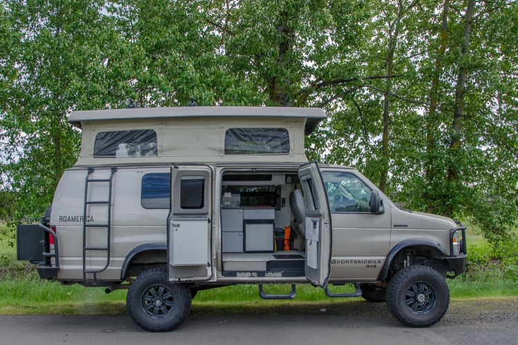 Inside look of 4wd Ford Econolibe Sportsmobile for sale in Portland, Oregon through Roamerica camper van rental company