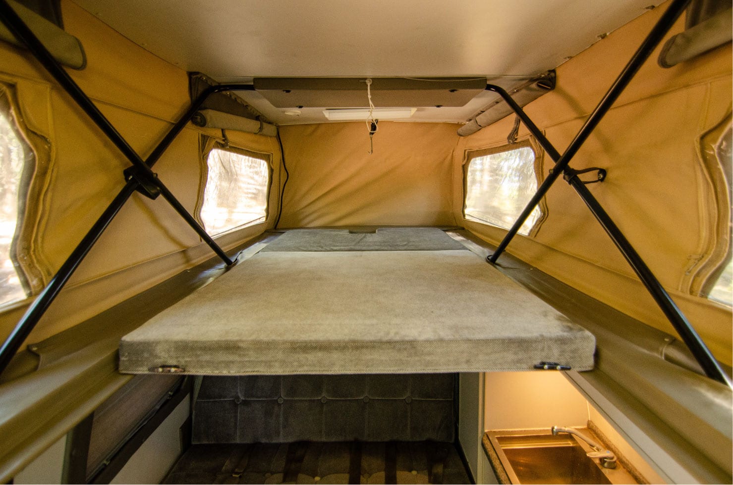 upper penthouse bed of Ford E-Series 4x4 Econoline Sportsmobile EB50 Layout Campervan conversion for sale